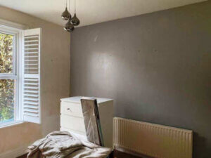 Image looking at the original feature wall battleship grey colour.