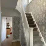 Hall Stairs and Landing Wallpapered With Laura Ashley Wallpaper Called Josette Steel