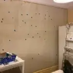Each wall repair marked with blue tape